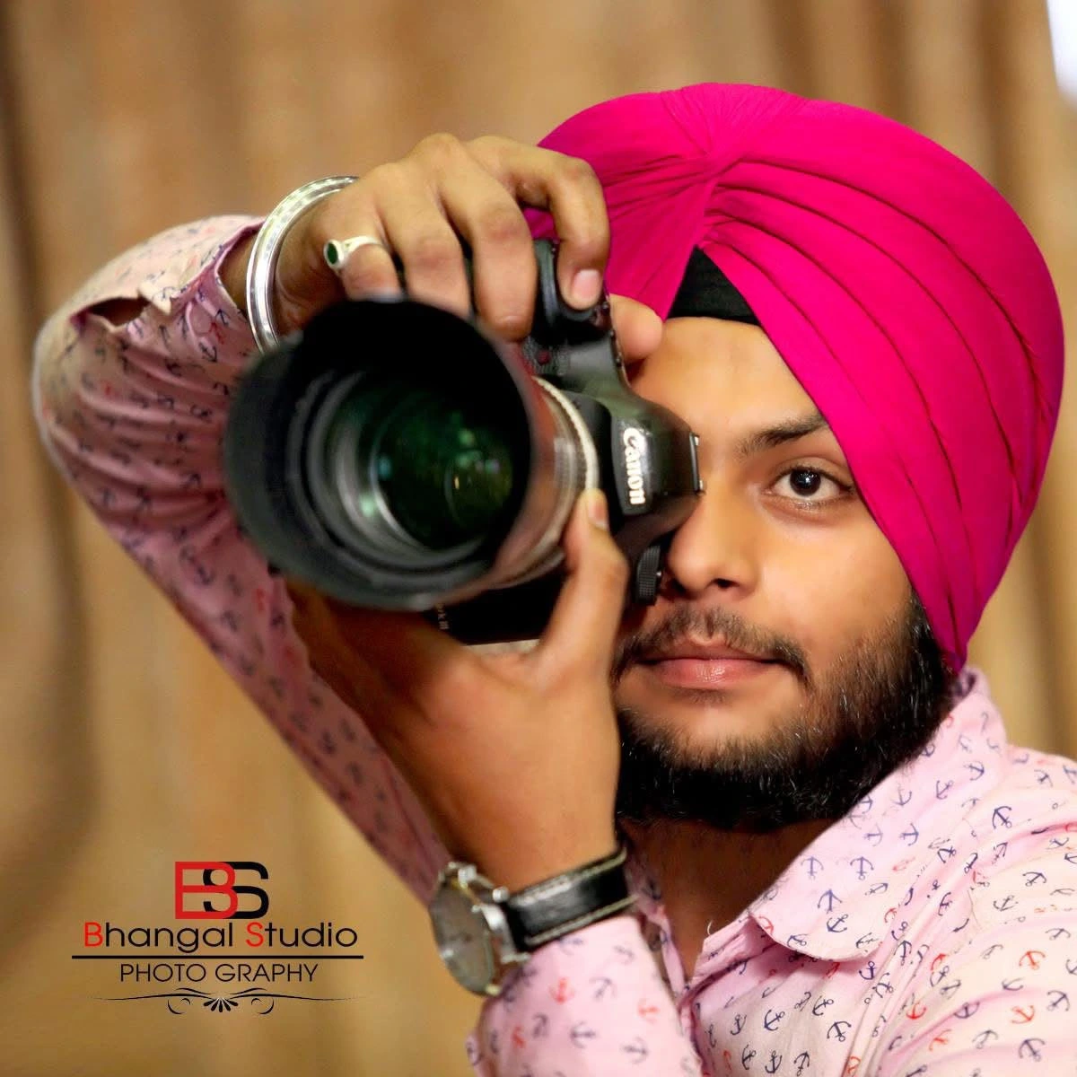Jovanpreet photographing with the camera at his eye in 2014